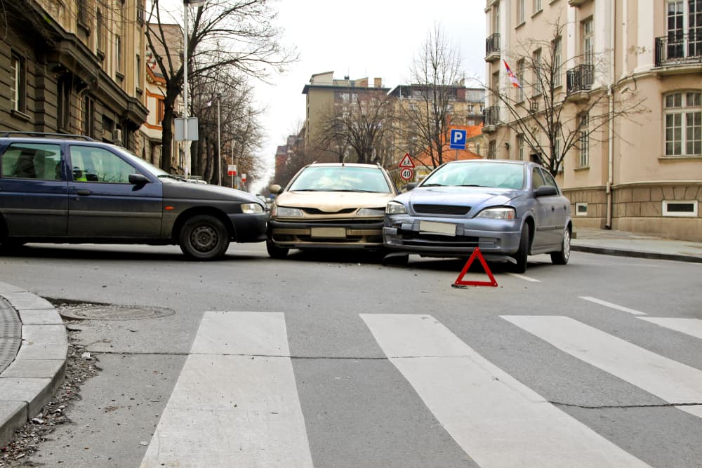 Three car crash traffic accident at street